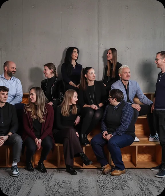 . A group photo of several people in a professional setting.